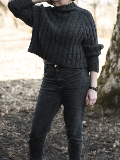 Dark grey Midnight jumper knitted sweater worn outdoors, showing ribbed texture and relaxed fit.