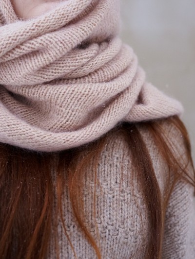 Close-up of Ruke Shoulder Shawl knitting pattern showing soft stockinette stitch texture and smooth knit fabric