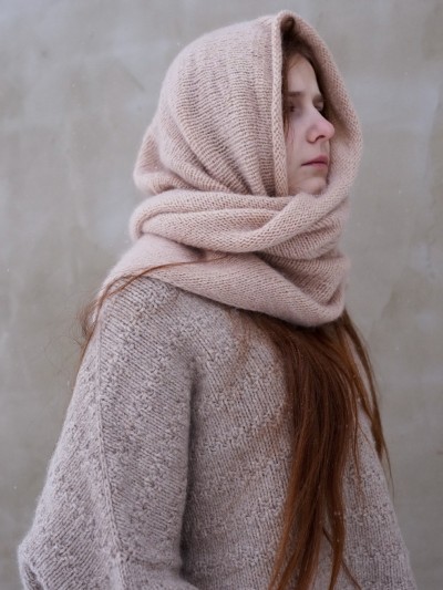 Side view of Ruke Shoulder Shawl knitting pattern worn as hooded shoulder shawl, timeless hand knit design