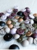 Assorted matte metal shank-back buttons in multiple colours shown in a flat lay