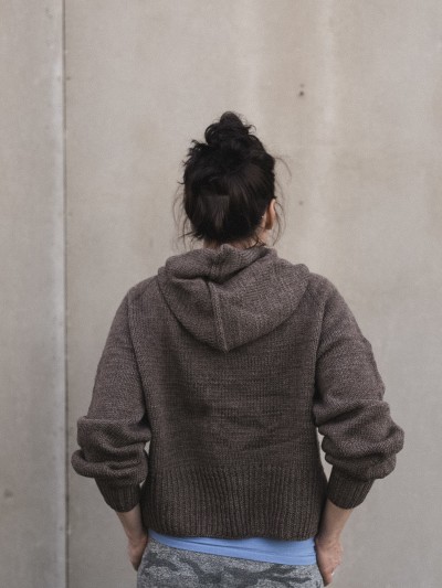 Autumn Hooded cardigan knitting pattern back view on model with hood detail