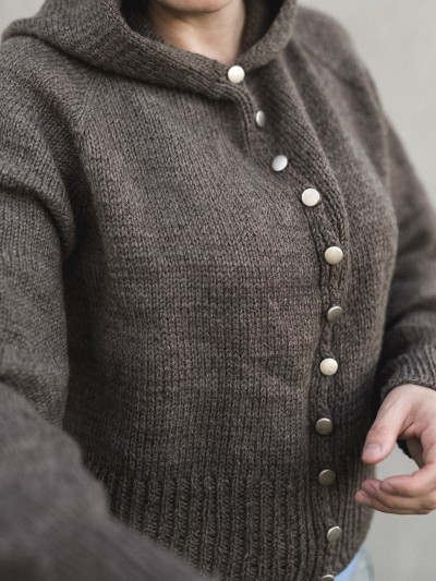 Autumn Hooded cardigan knitting pattern close-up of button band and ribbed hem