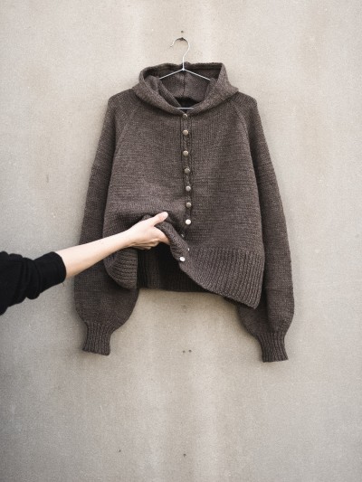 Autumn Hooded cardigan knitting pattern flat lay with hood and balloon sleeves