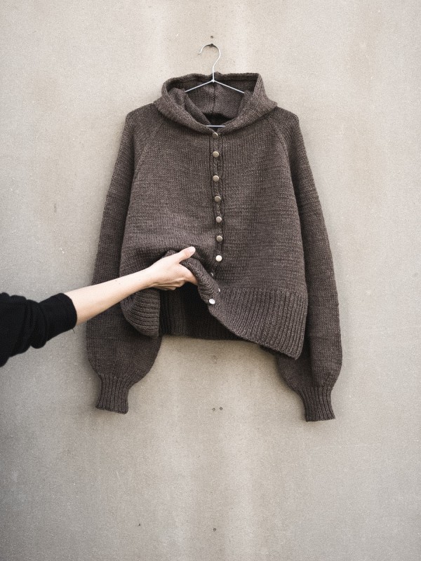 Autumn Hooded cardigan knitting pattern flat lay with hood and balloon sleeves