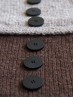 Close-up of Ruke black 28 mm four-hole bioresin buttons on brown knit