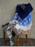 Grandma’s Crocheted Blanket crochet pattern displayed on a wooden chair by Ruke Knit