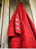 Red Ruke Moon cardigan knitting pattern button band detail on wooden wall