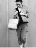 Black and white lifestyle view of a model wearing the Diamond Cardigan by Ruke Knit