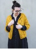 Model wearing the yellow Diamond Cardigan knitting pattern by Ruke Knit